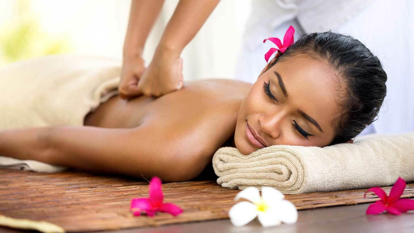 Body scrub being worked over the back